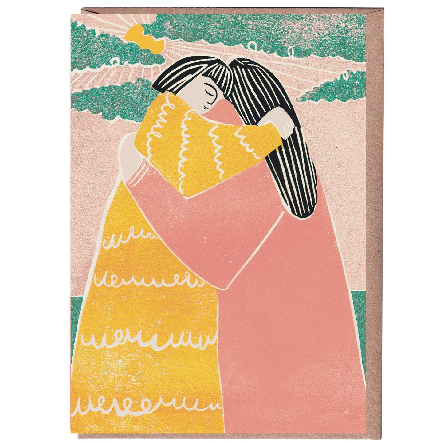 A greeting card with a linocut print illustration of two figures embracing, with one figure in a yellow dress and the other in a pink coat. The background is a light beige color with some greenery at the top.