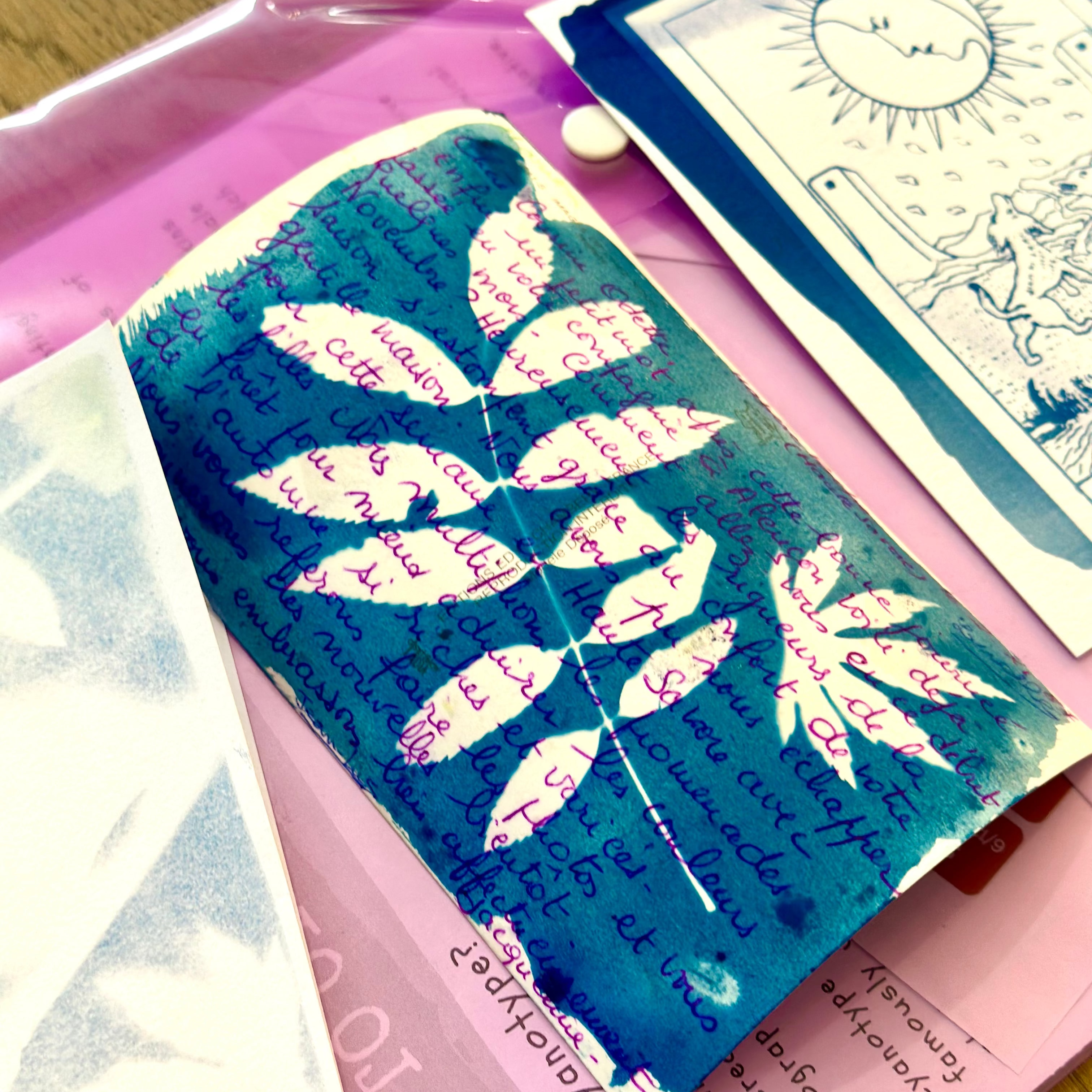 Artistic card with leaf design and text on a pink background