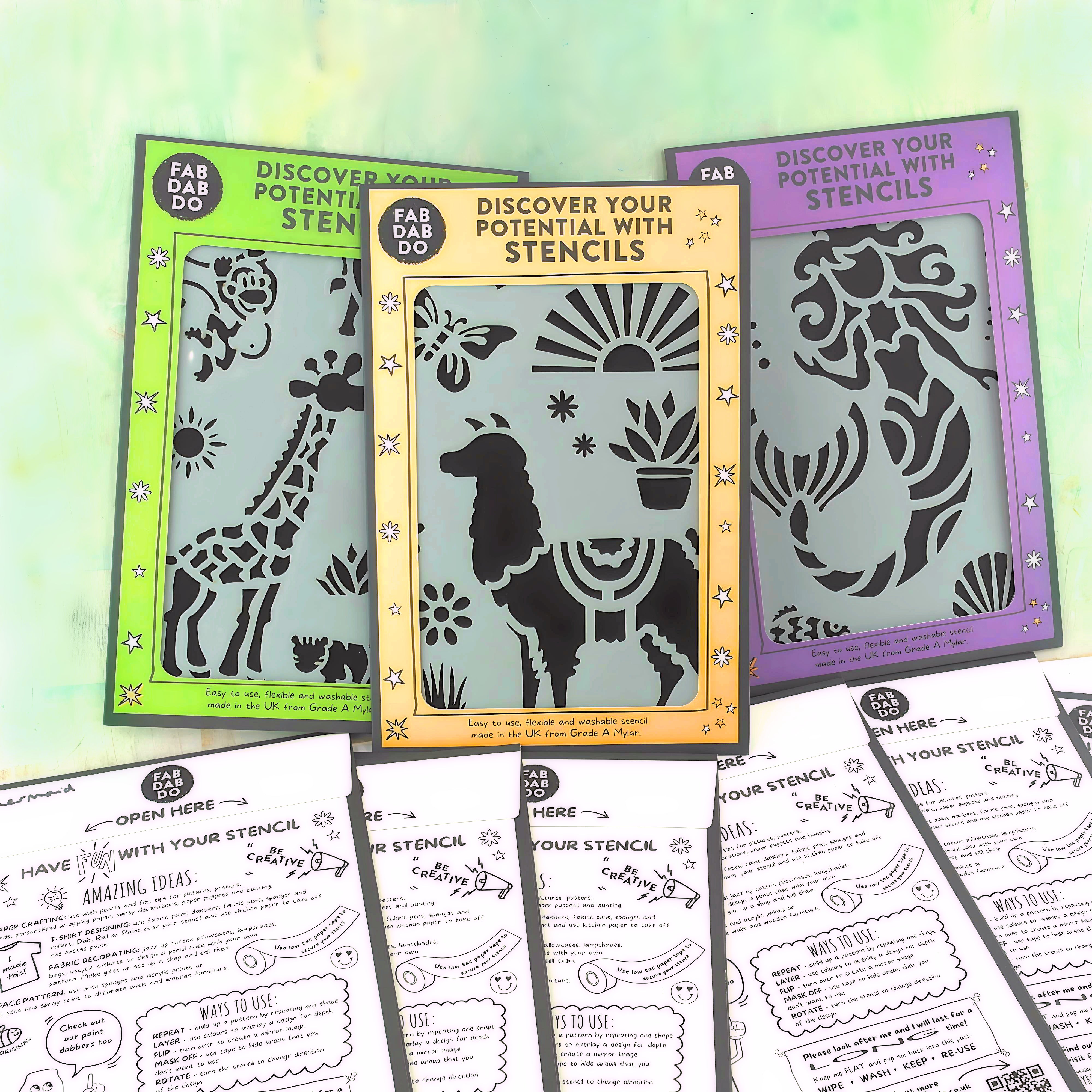 Three packages of fabric stencils in vibrant colors displayed with unrolled stencils showing animal and floral patterns, indicating use for textile painting.