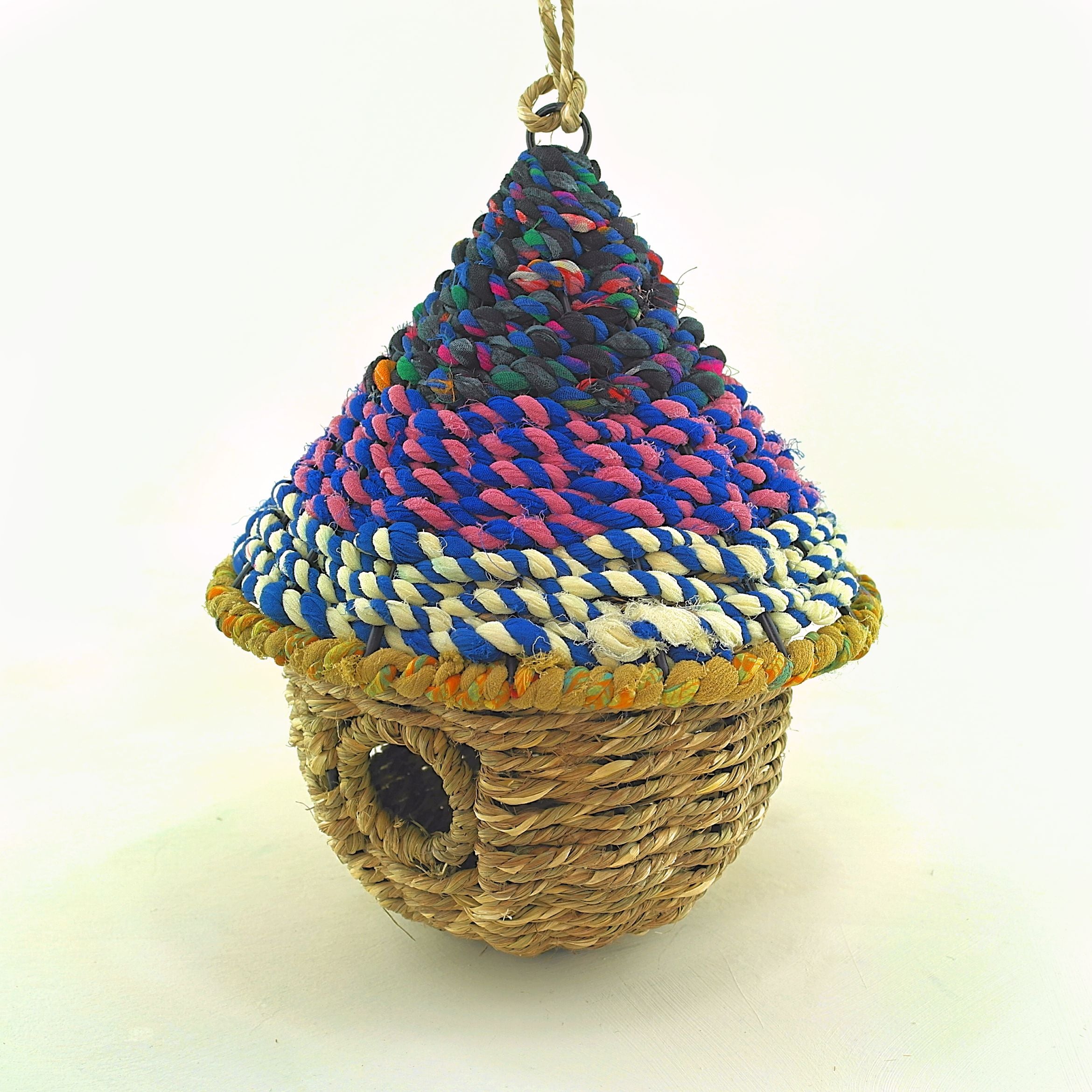 Bird nester in grass and sari fabric, pod shape