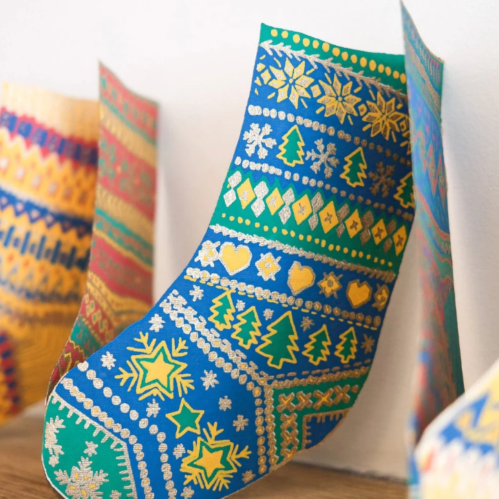 A screenshot of a Shopify website page for Clothkits, showing a product listing for a 'garland' with two photos of knitted textile items and a product information panel on the right.