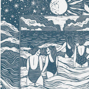 Framed artwork of three women in swimsuits by a body of water with celestial elements.