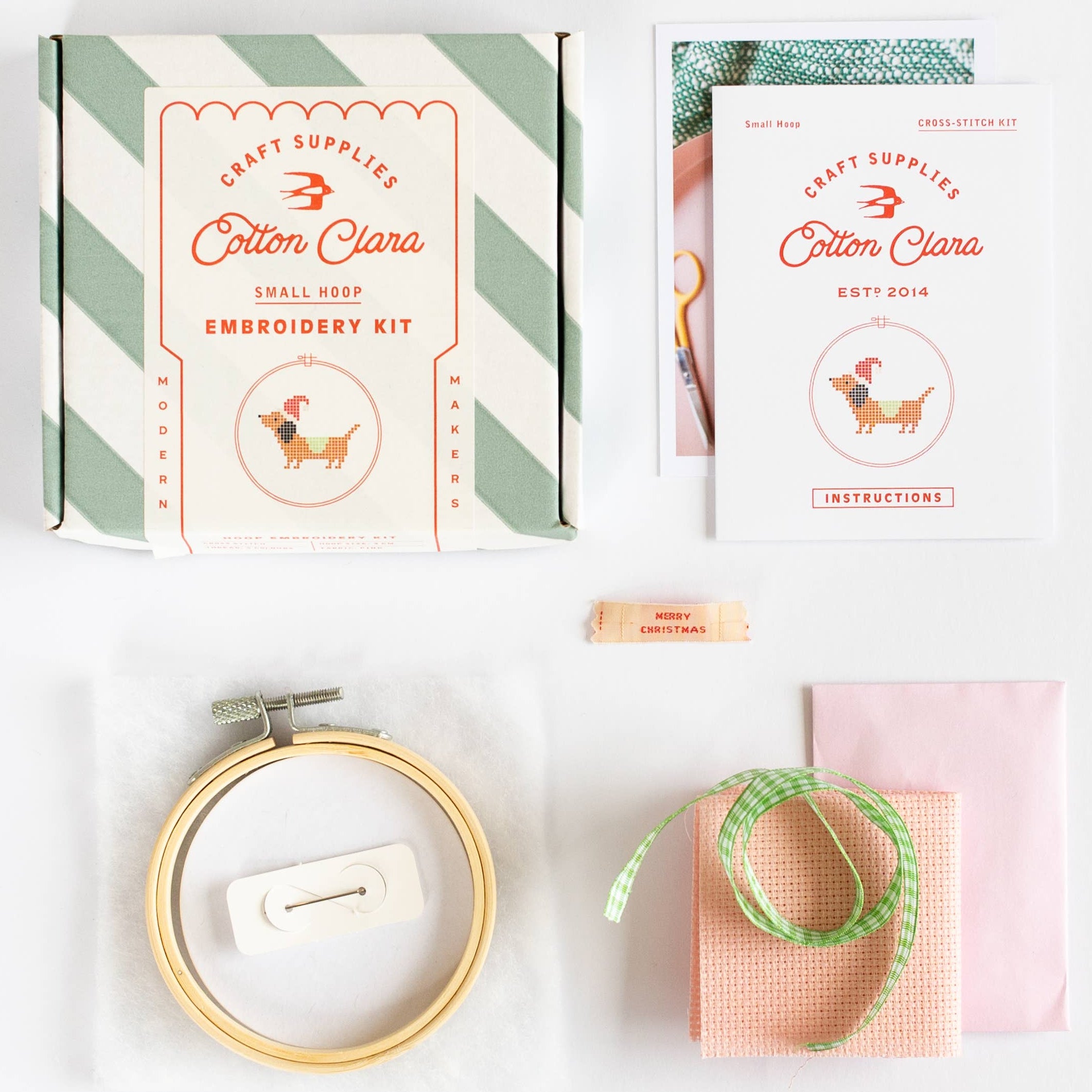 Embroidery kit with hoop, thread, and packaging on a white background