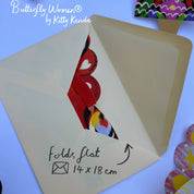 Card with butterfly design and folding instructions on a colorful background