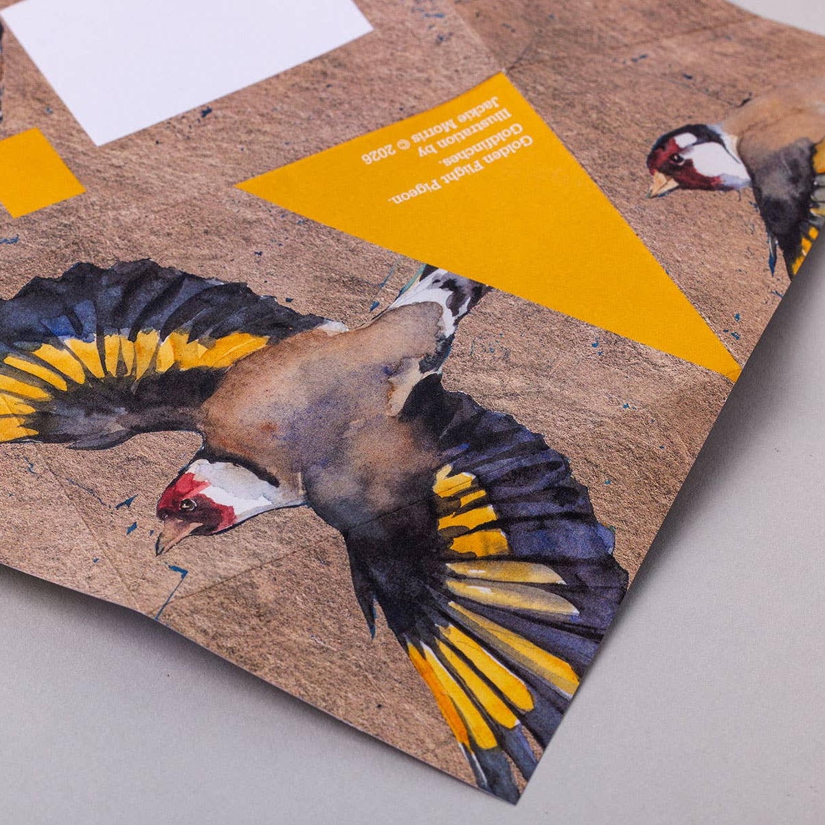 Card with bird illustrations on a textured surface