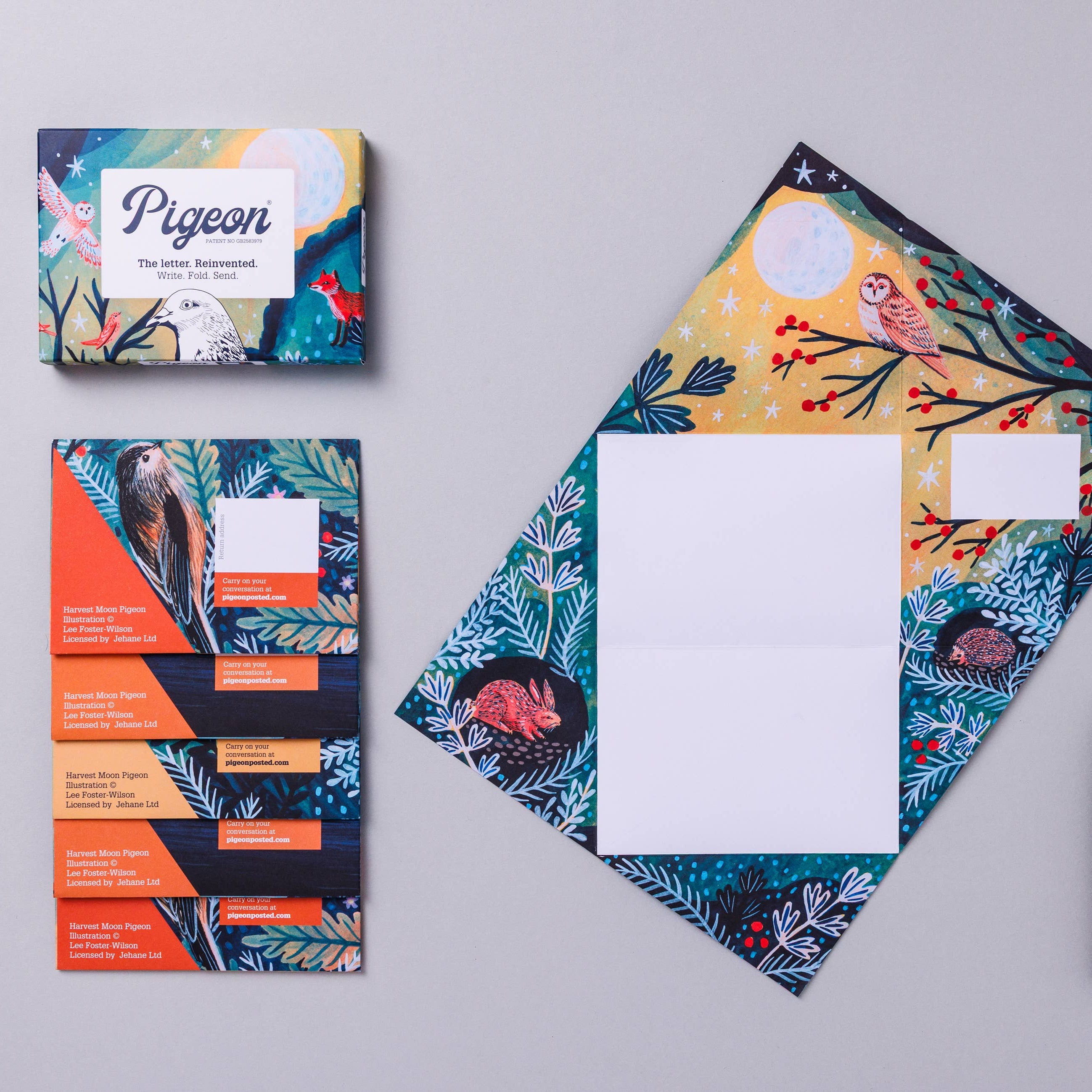 Colorful stationery set with envelopes and cards on a gray background