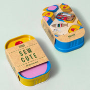 Colorful sewing kit with 'Sew Cute' text on a light gray background