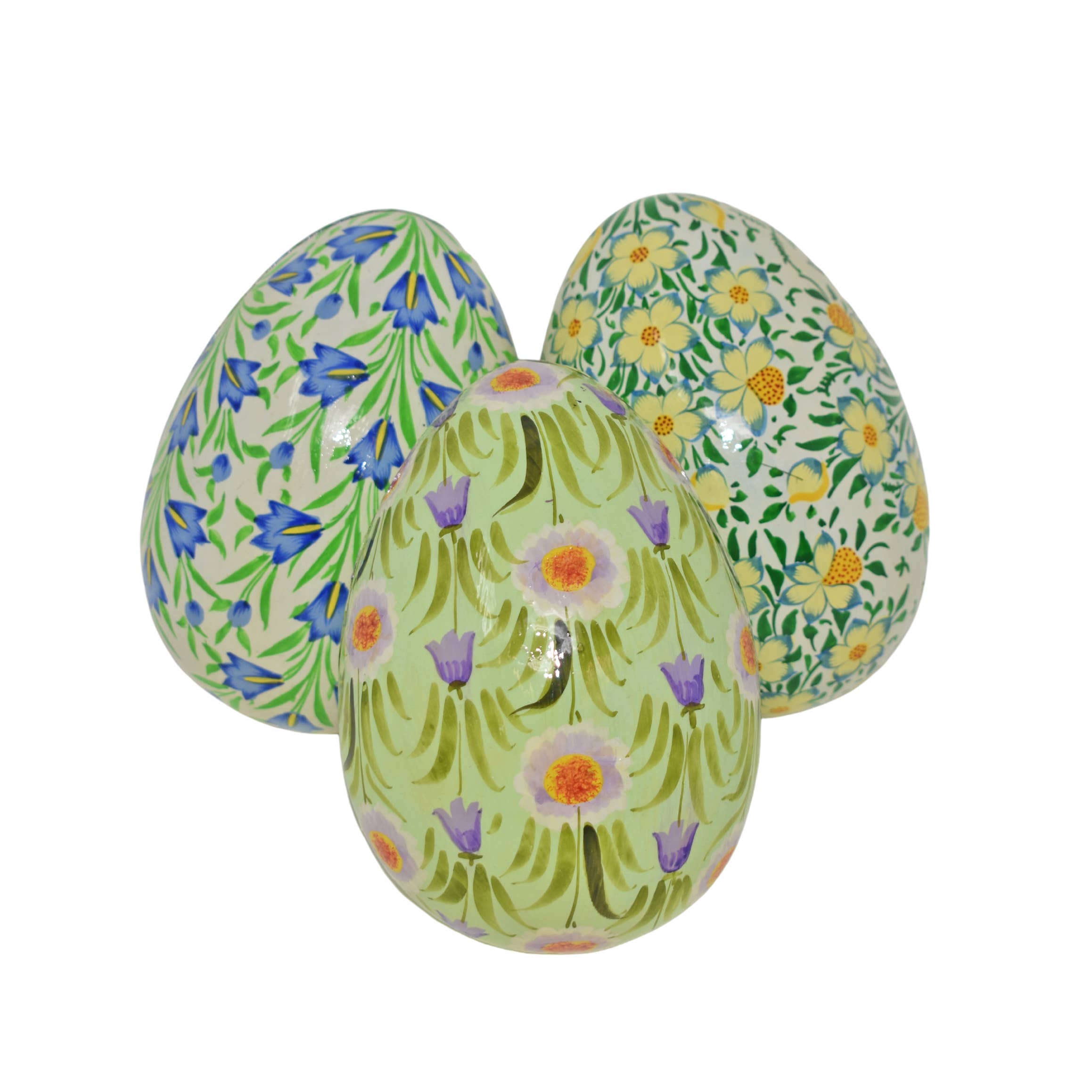 Three floral-patterned eggs on a white background
