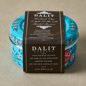 DALIT candles packaging with decorative design on a beige background