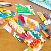 Artistic creations on a wooden table with绘画工具