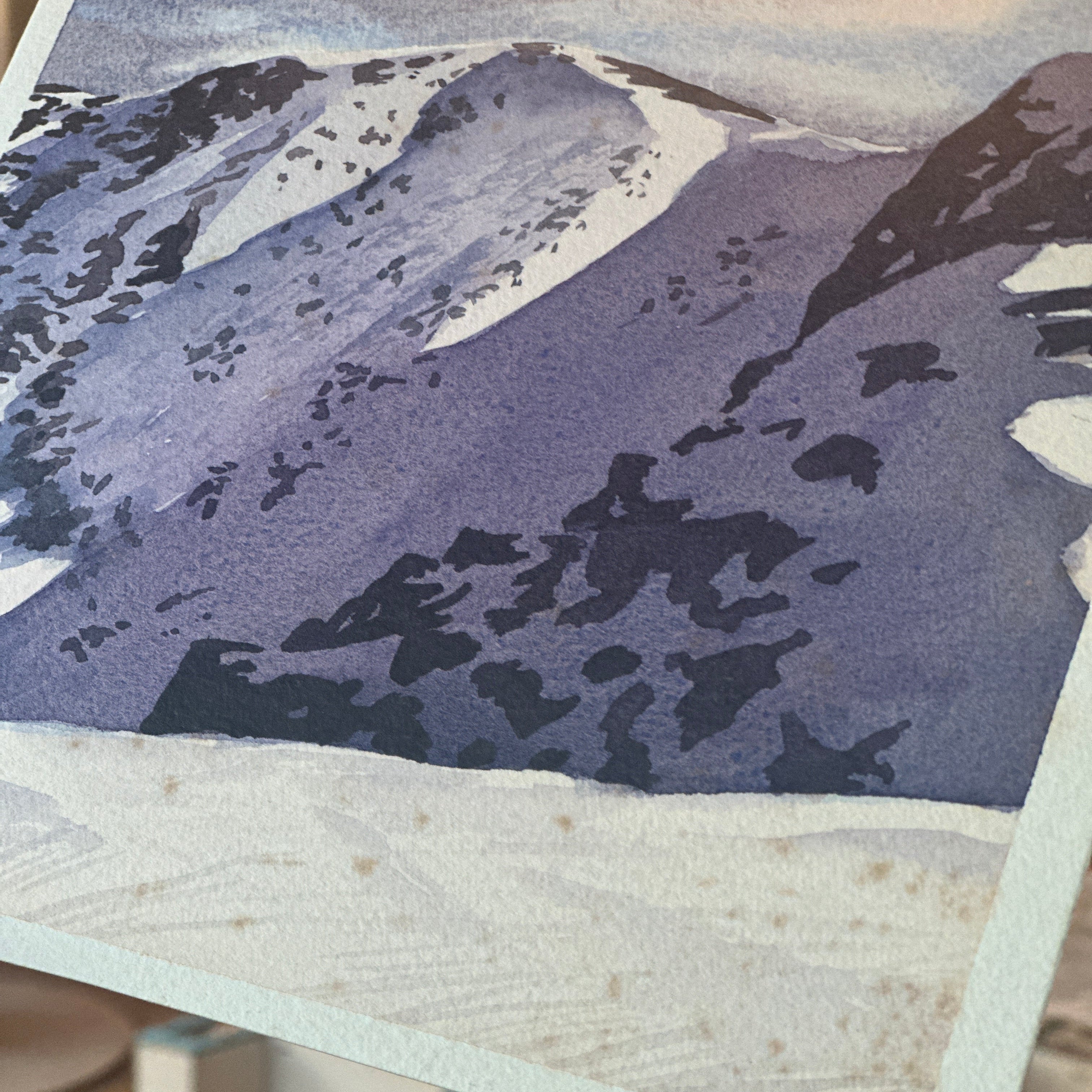 Close-up of a textured surface with a focus on a purple and white pattern.