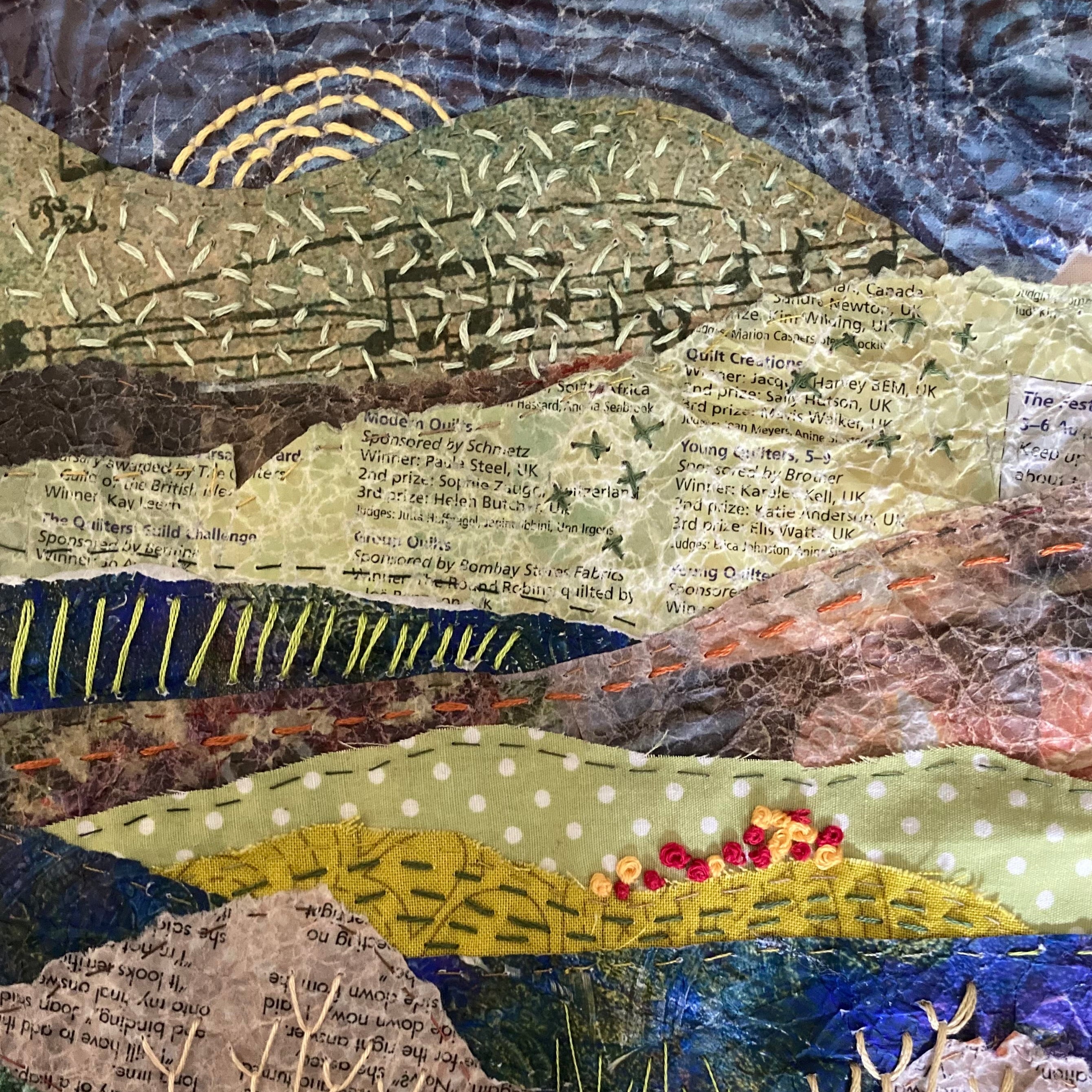 Textile art piece with various textures and colors