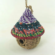 Bird nester in grass and sari fabric, pod shape