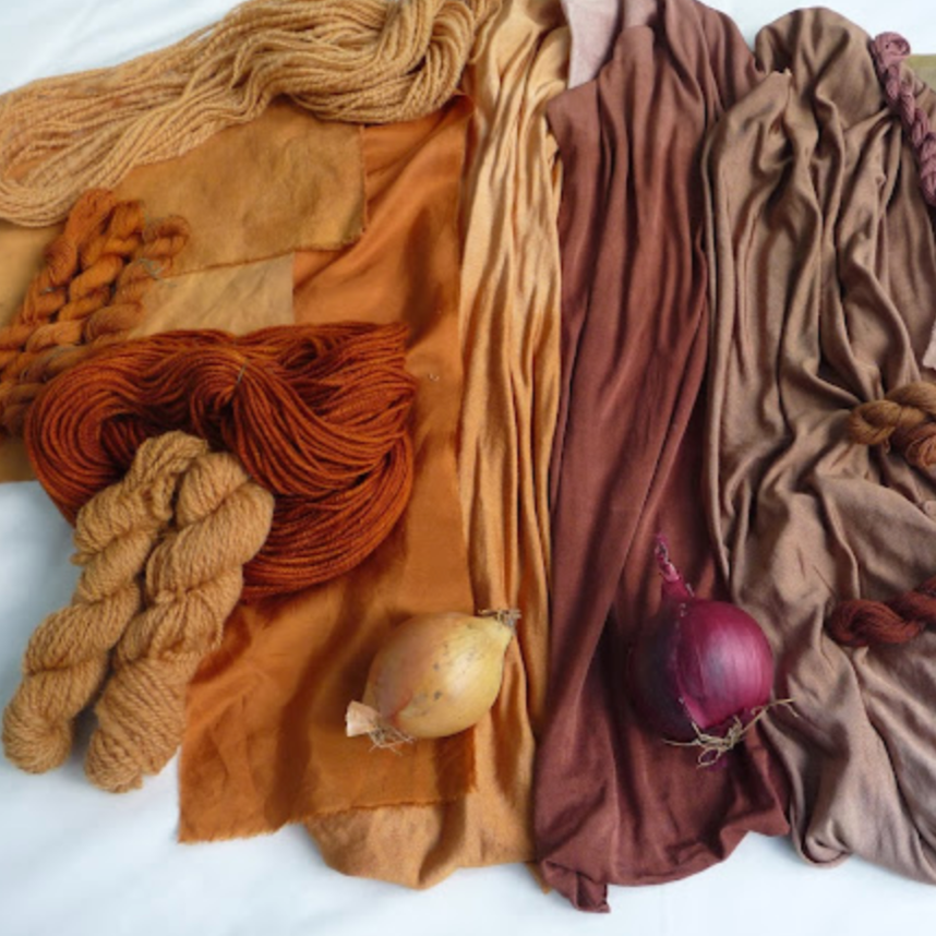 Collection of yarn in various colors on a white background