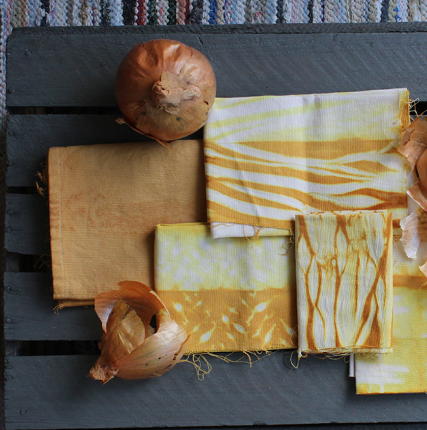Textiles with natural patterns and colors on a wooden surface