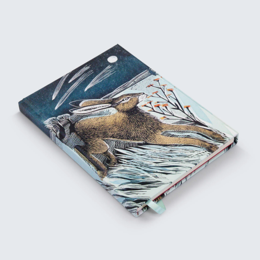 A product listing page for a Shooting Stars Hardback Foiled Journal on a Shopify website. The page shows a product image of a hardback journal with a colorful tiger and water illustration on the cover, 
