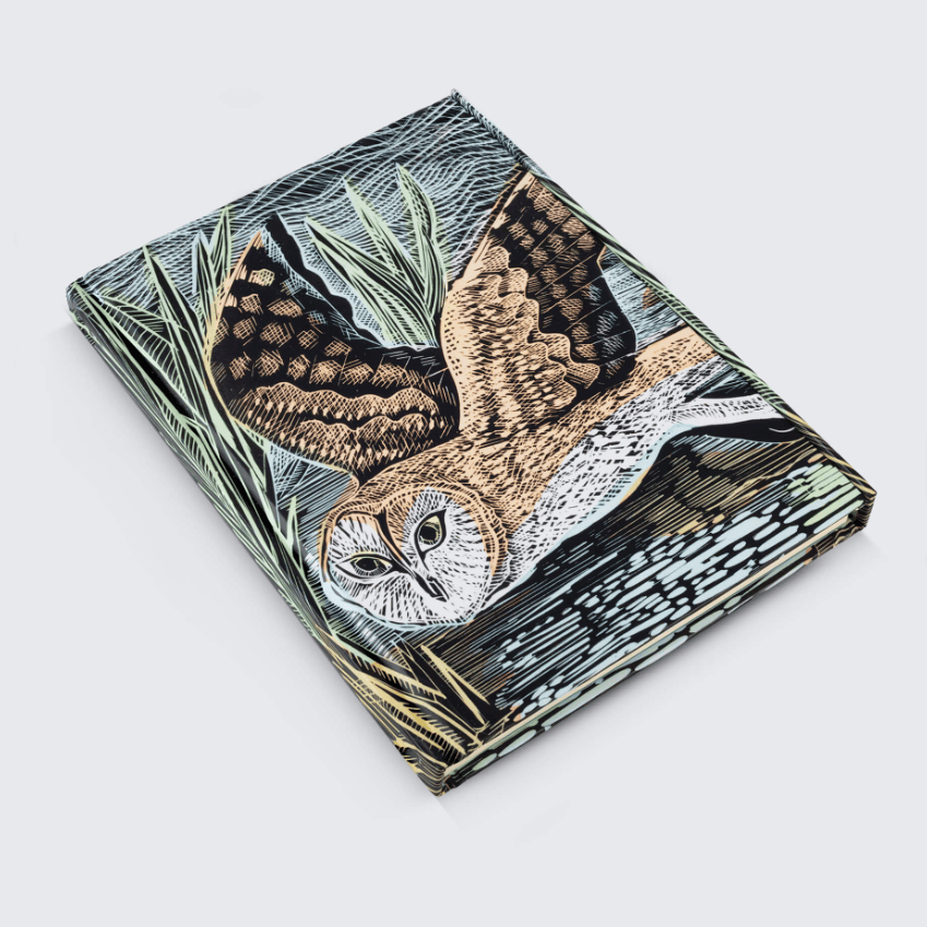 A product listing page showing a marsh owl hardback folio journal with a detailed marsh and owl illustration on the cover, displayed alongside product details on a white webpage layout.