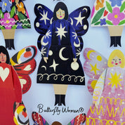 Colorful paper dolls with butterfly wings and colorful dresses, featuring the brand 'Kitty Kenda'.