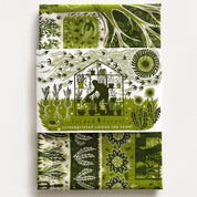 Green and white patterned tea towel with screenprinted design on a white background