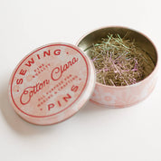 Sewing pins tin with 'Cotton Clara' branding on a white background
