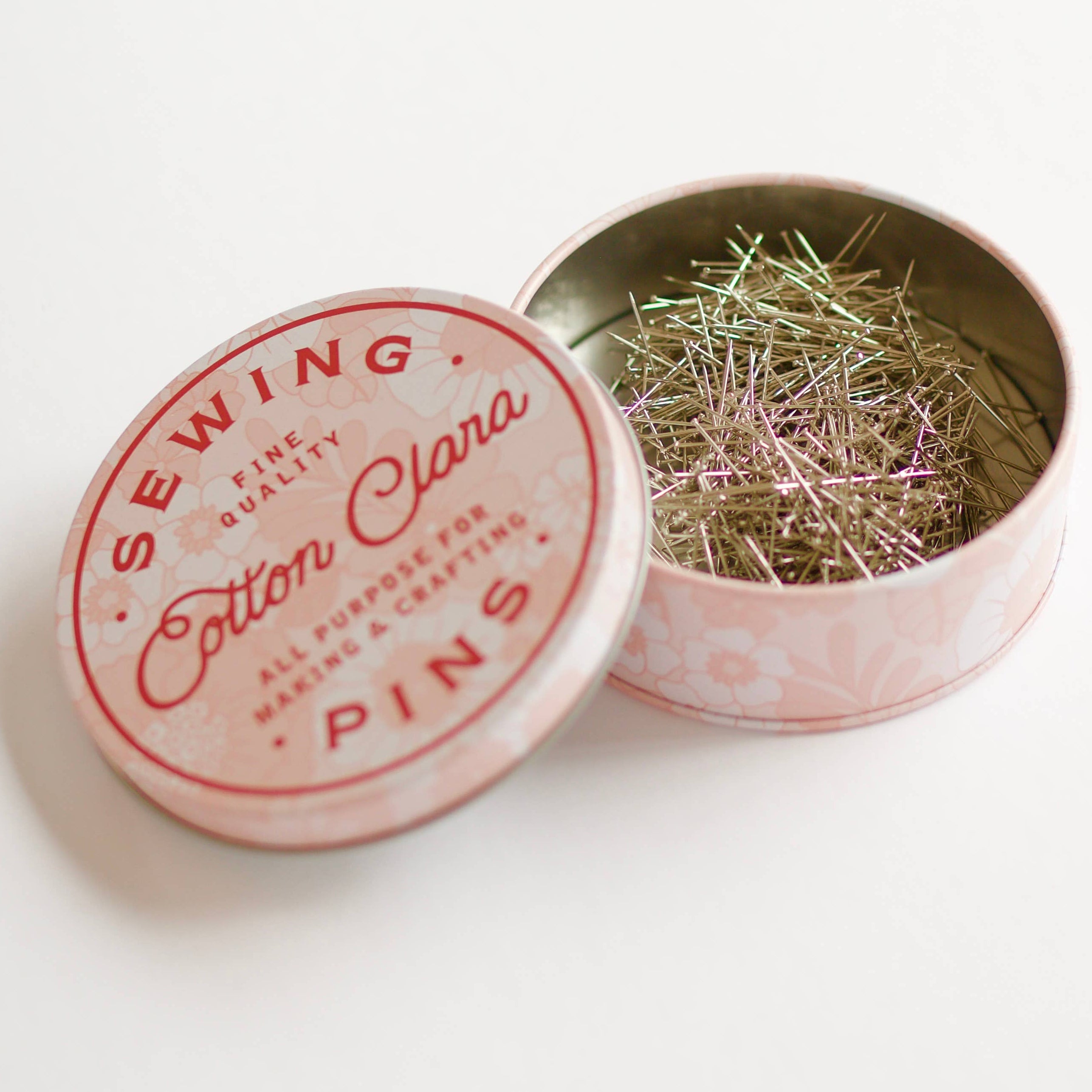 Sewing pins tin with 'Cotton Clara' branding on a white background
