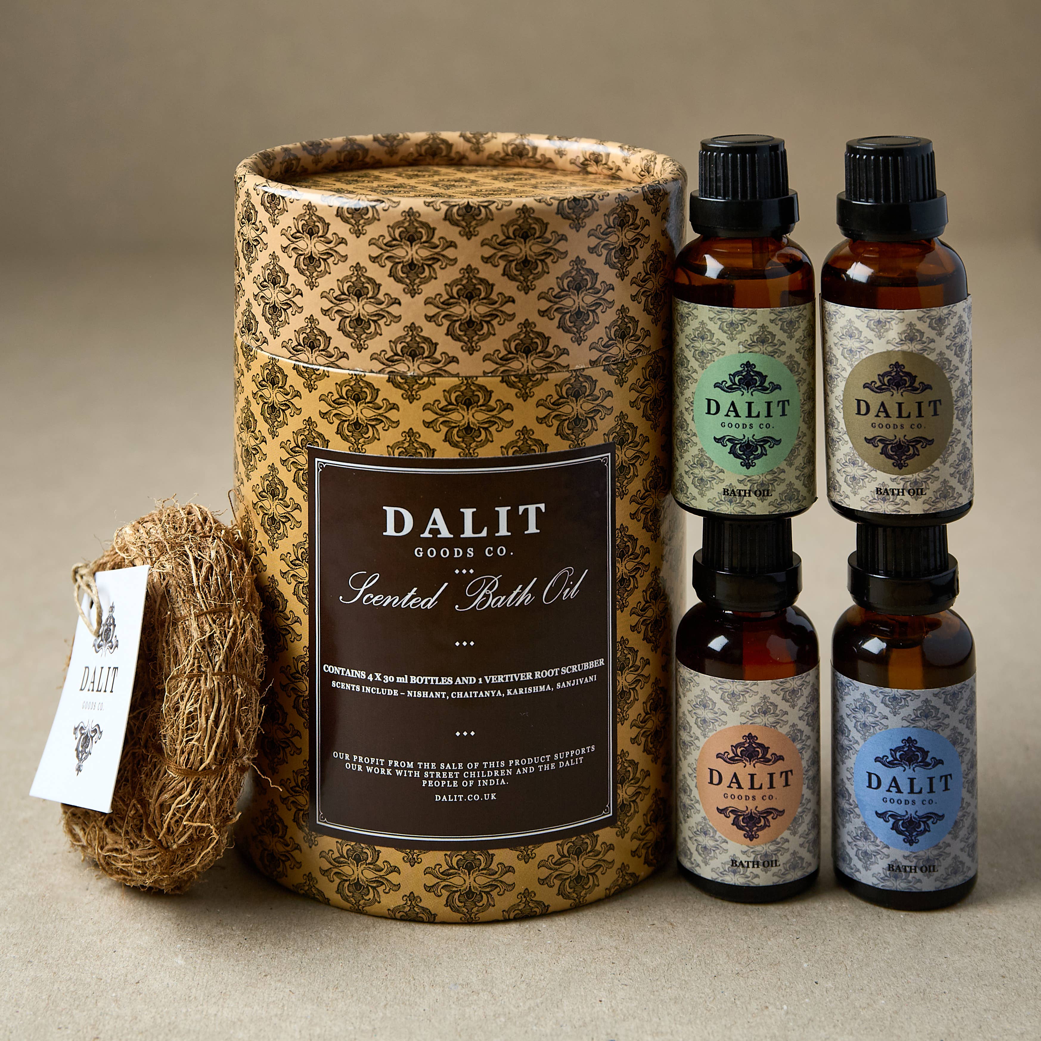 Dalit Goods Co. scented bath oil set with decorative container and bottles on a beige background
