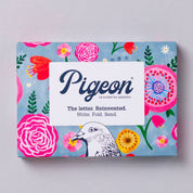 Pigeon product packaging with floral design and pigeon illustration on a light gray background