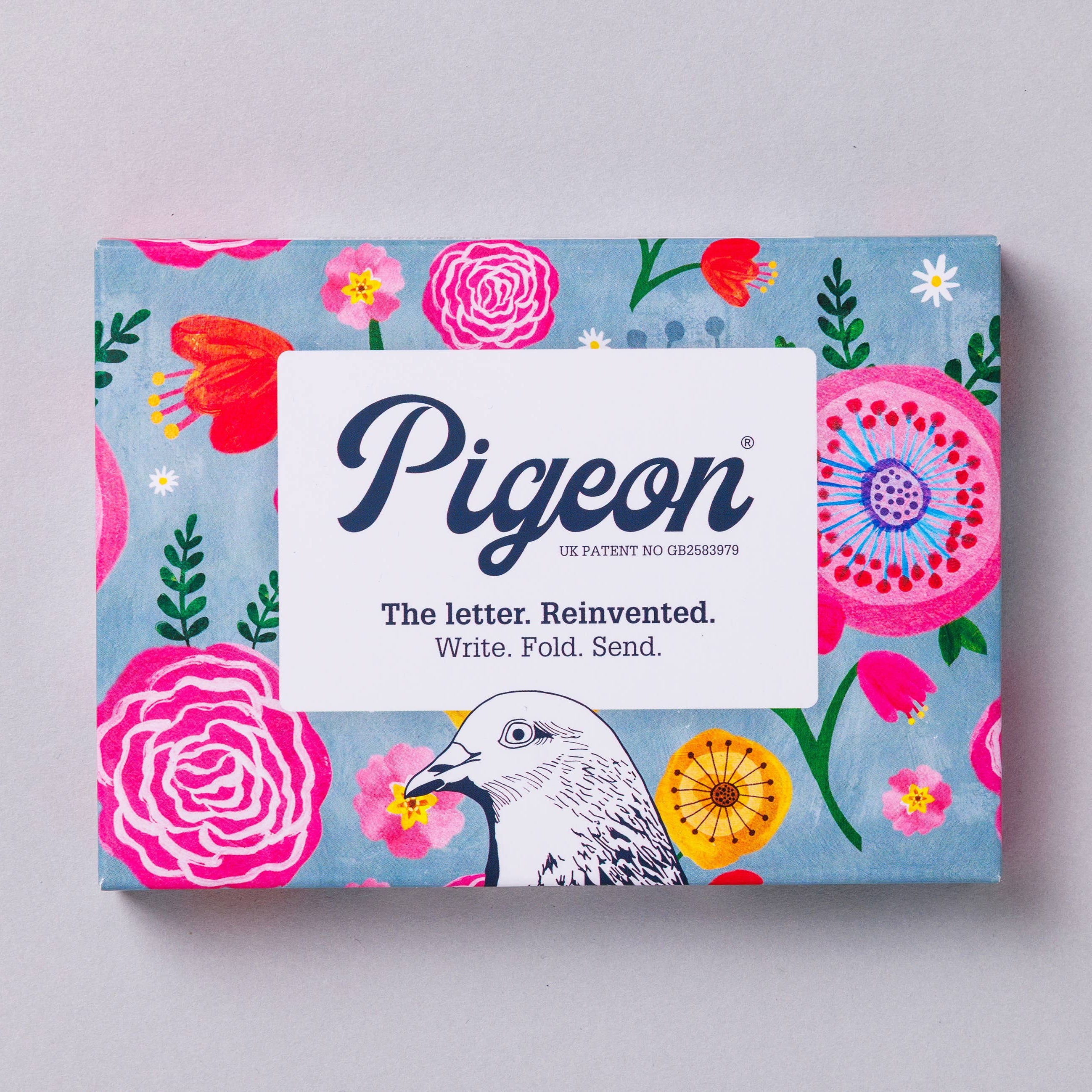 Pigeon product packaging with floral design and pigeon illustration on a light gray background