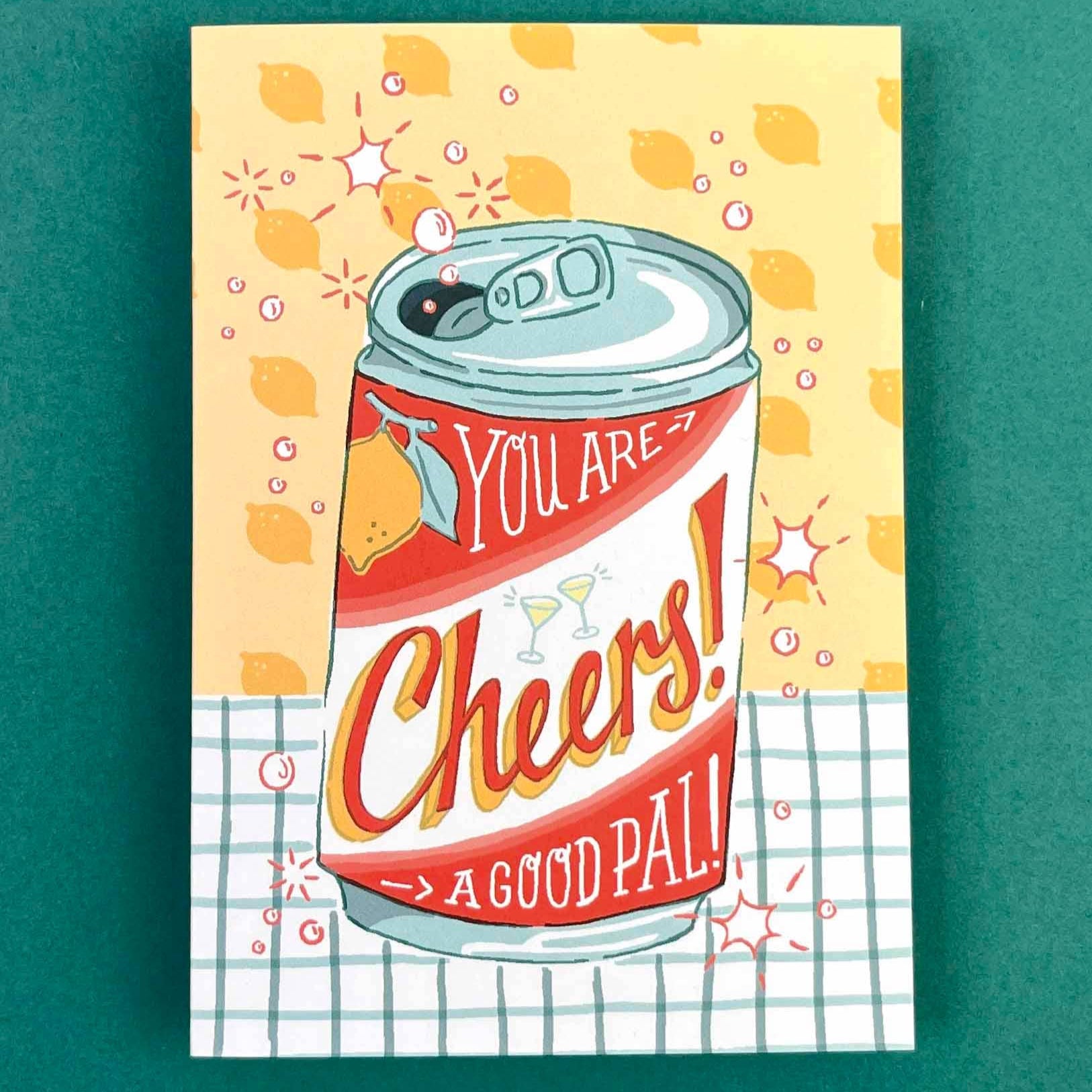 Illustrated can of 'Cheers!' with text on a yellow background