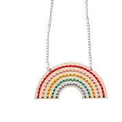 Rainbow-shaped pendant necklace on a white background