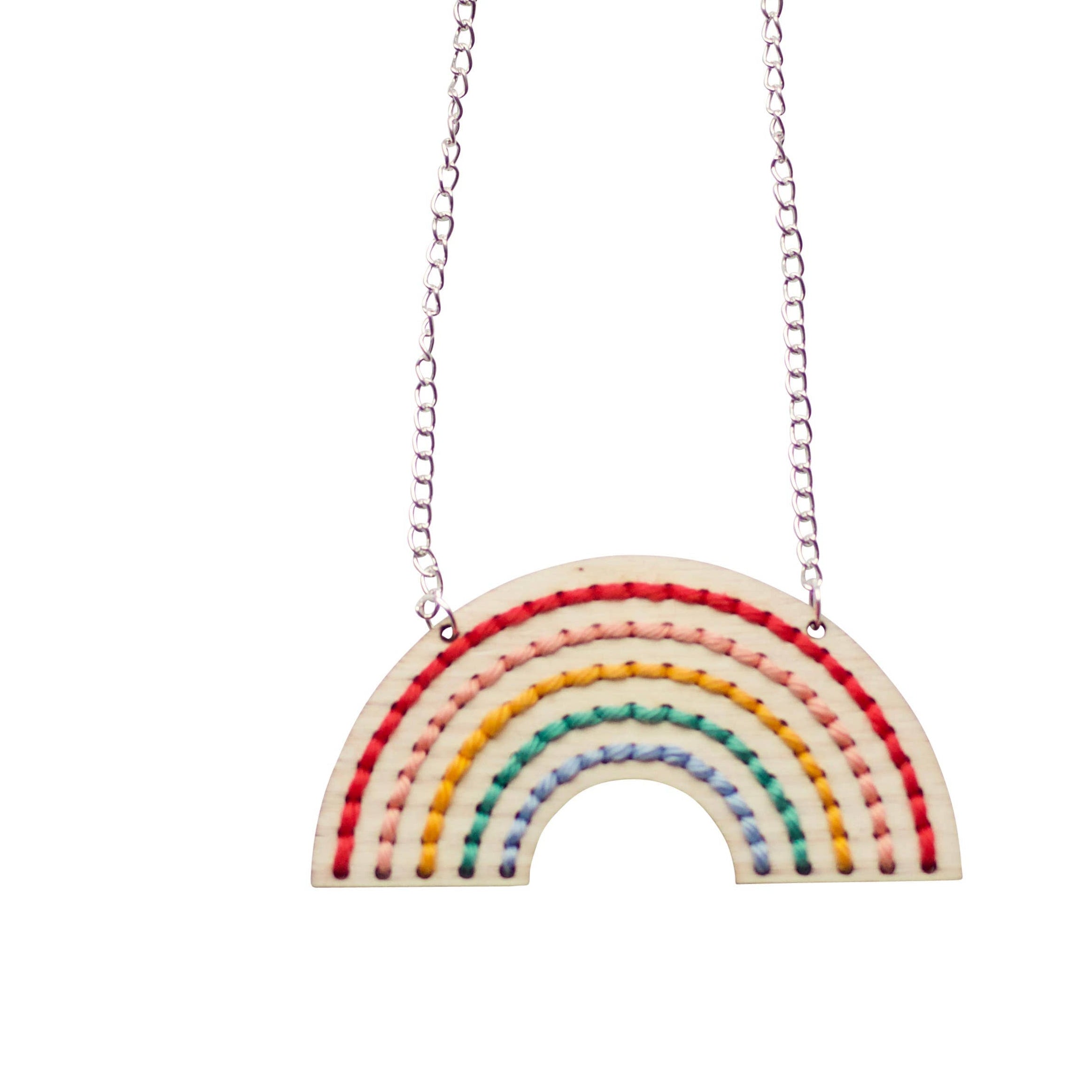 Rainbow-shaped pendant necklace on a white background