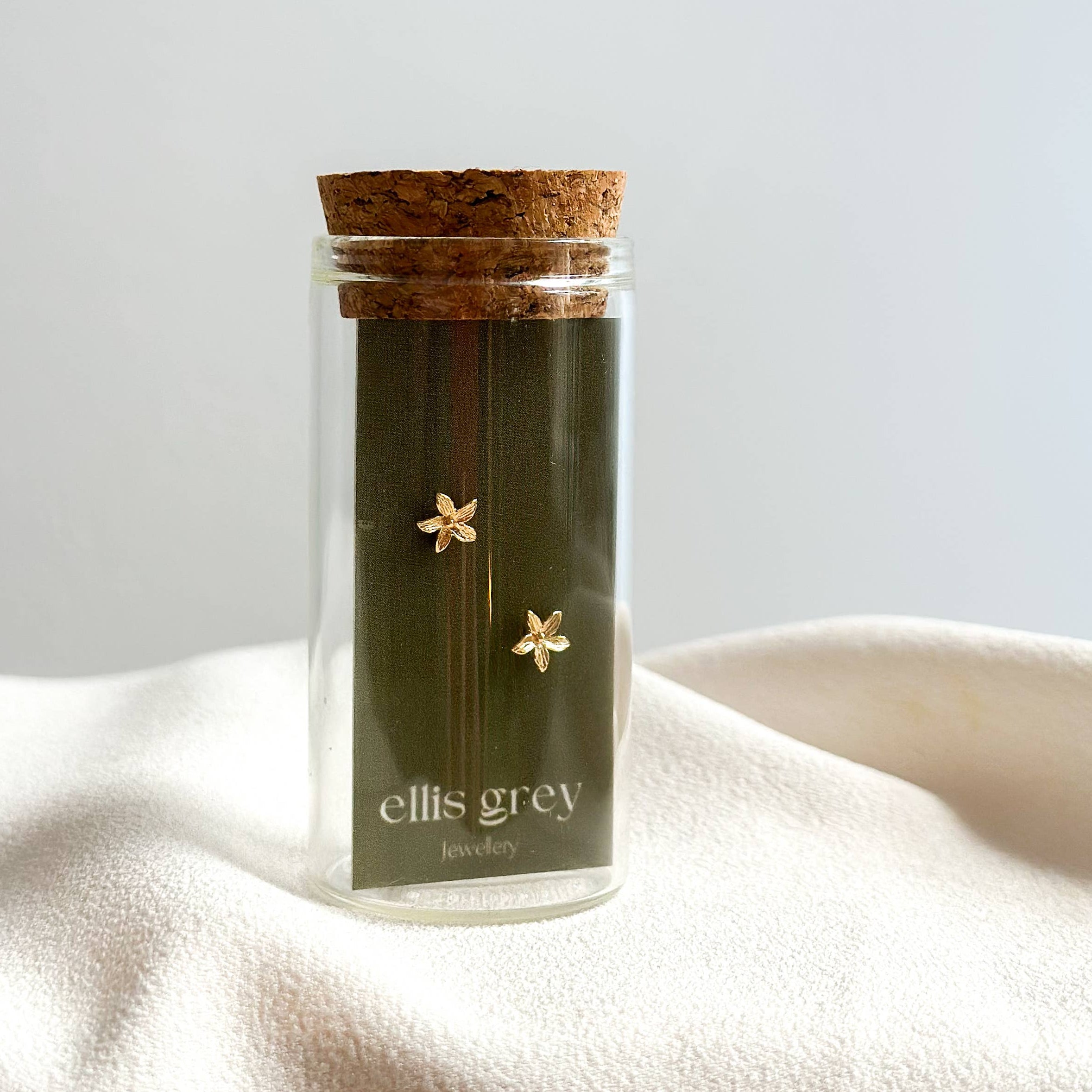 Jar of 'ellis grey' tea with cork lid on a white surface