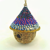 Bird nester in grass and sari fabric, pod shape