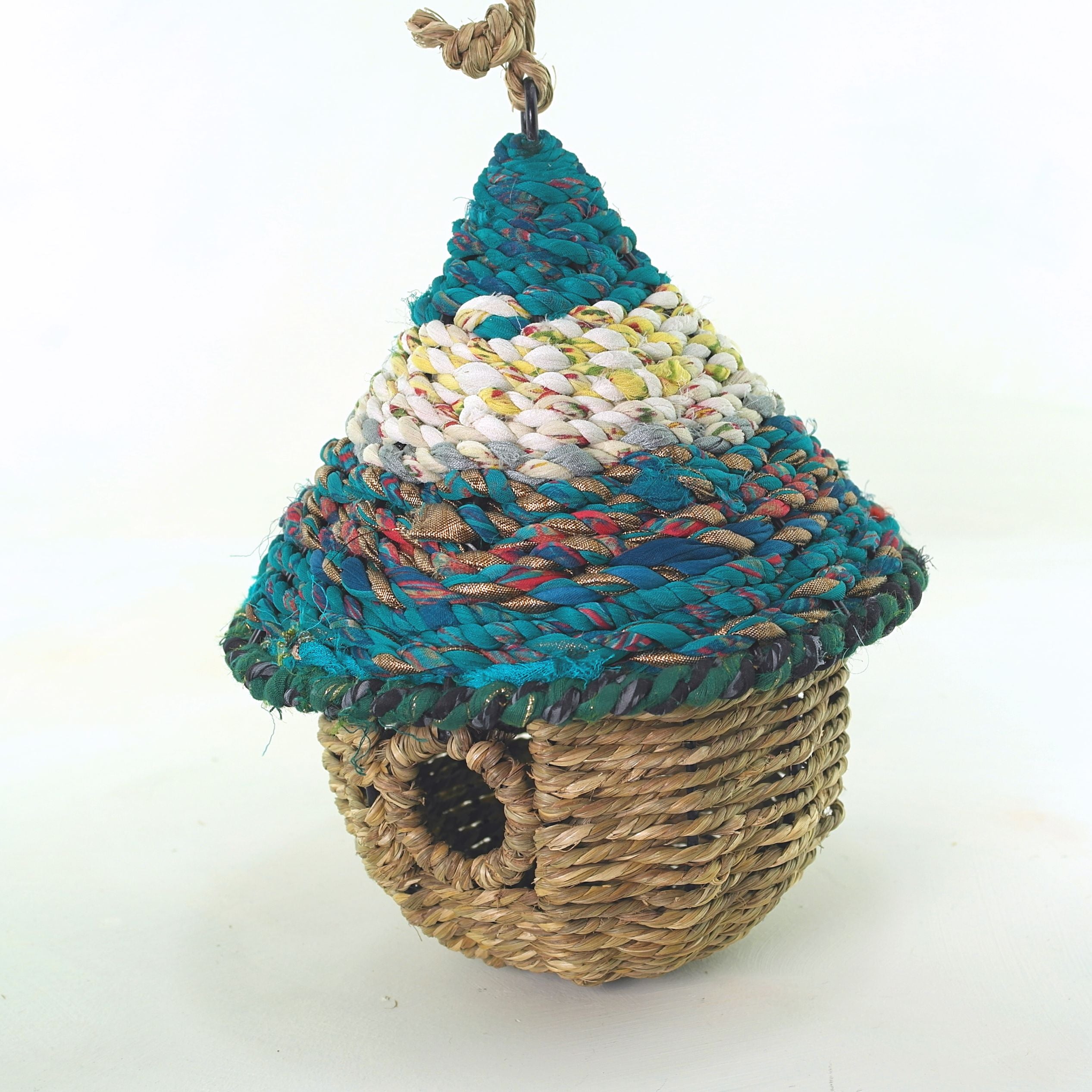 Bird nester in grass and sari fabric, pod shape