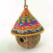 Bird nester in grass and sari fabric, pod shape