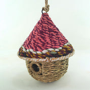 Bird nester in grass and sari fabric, pod shape