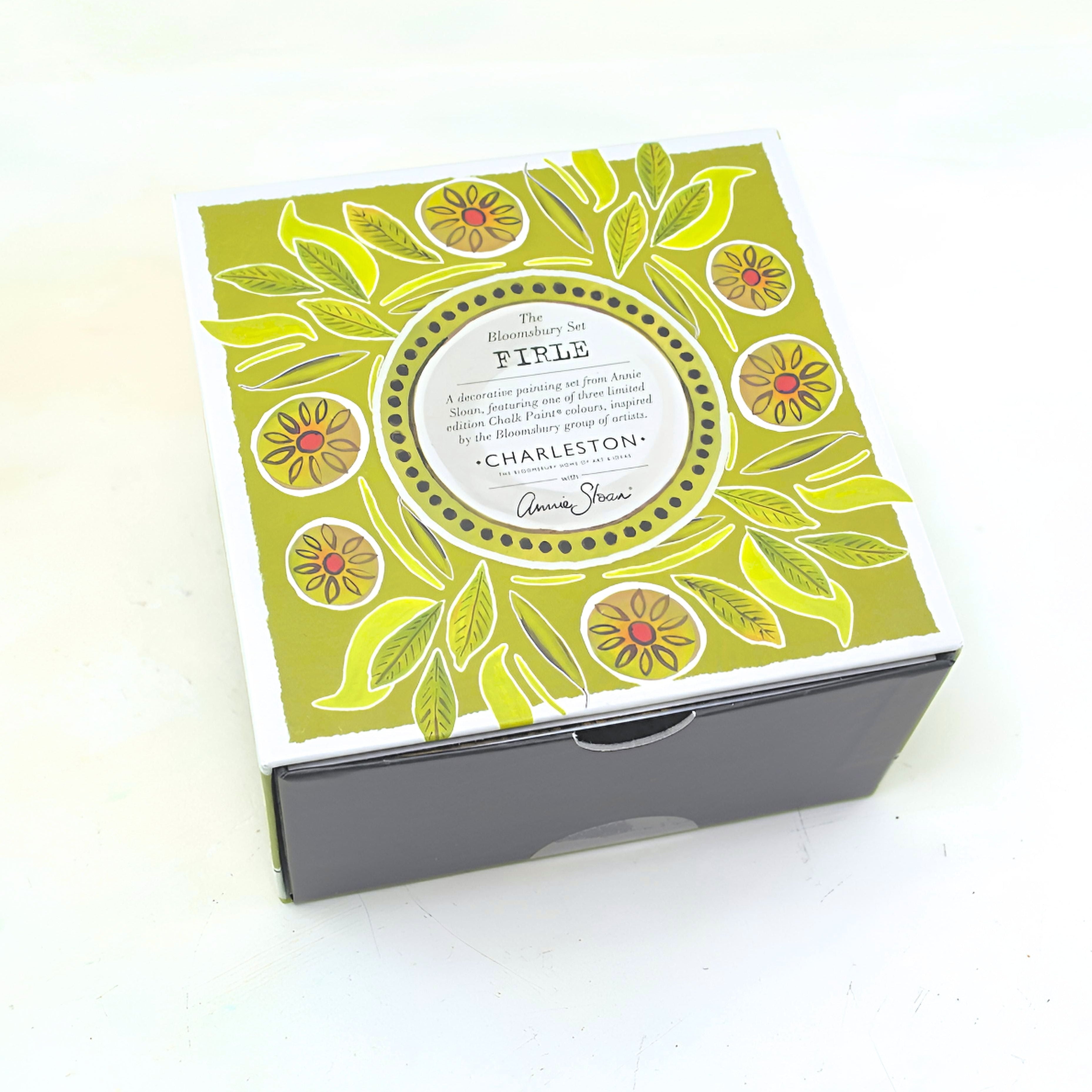 Decorative box with floral design and text on a white background