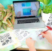 the linocut and print design process watching a free online video and drawing out botanical shapes to cut