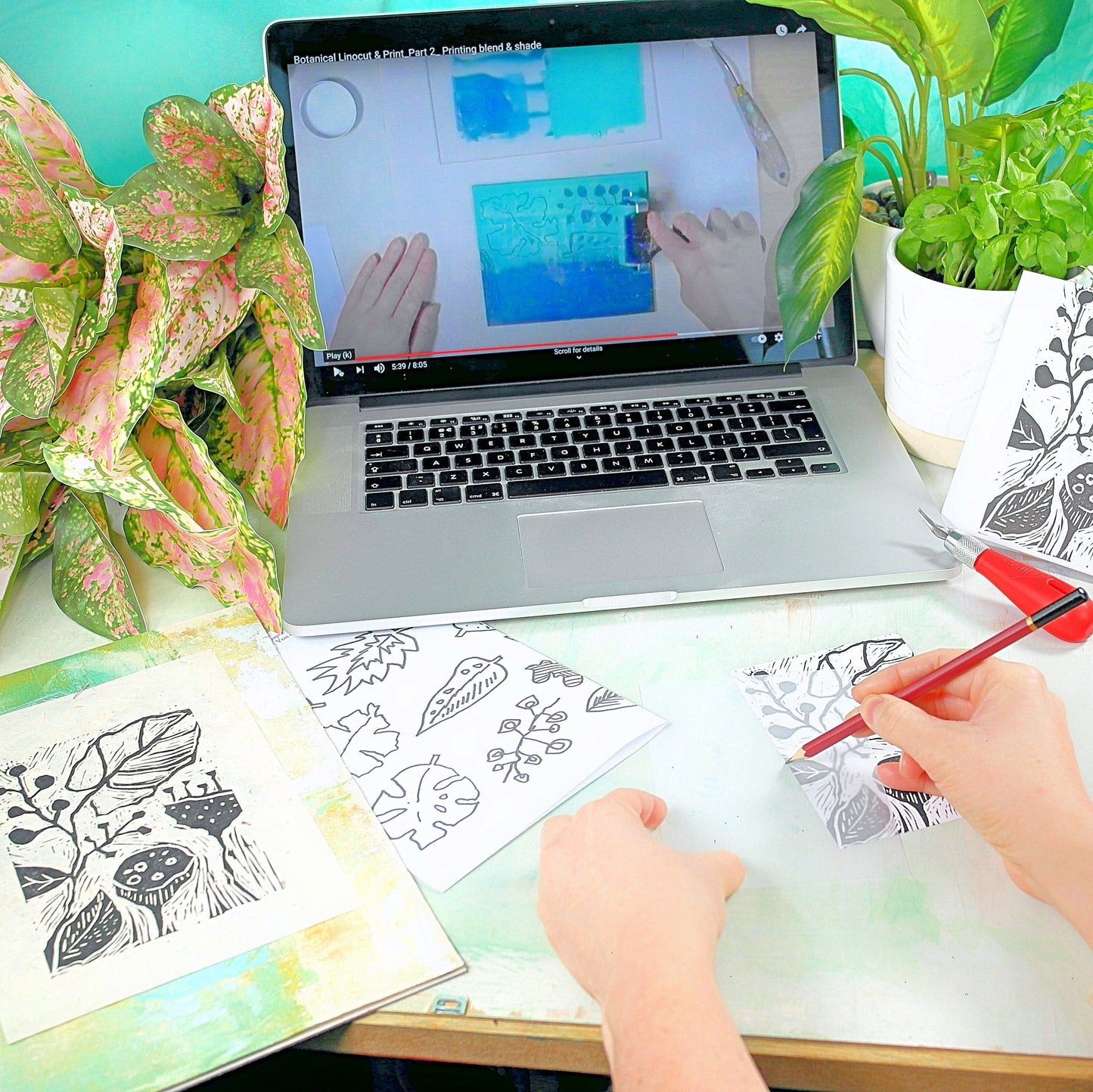 the linocut and print design process watching a free online video and drawing out botanical shapes to cut